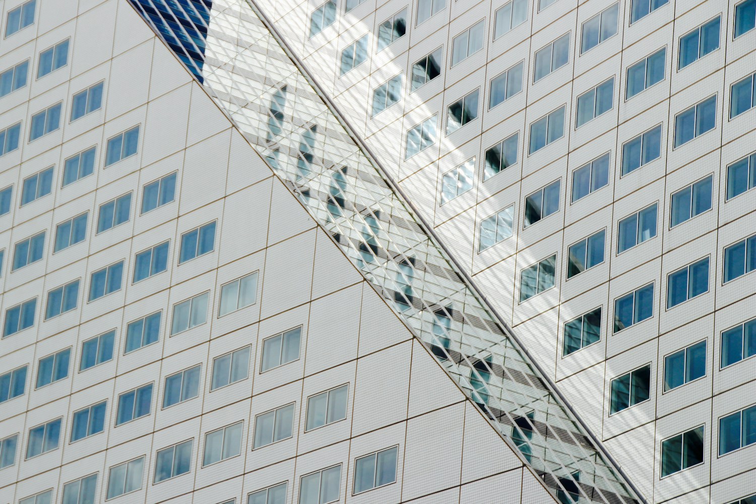 White concrete office buildings against a clear sky