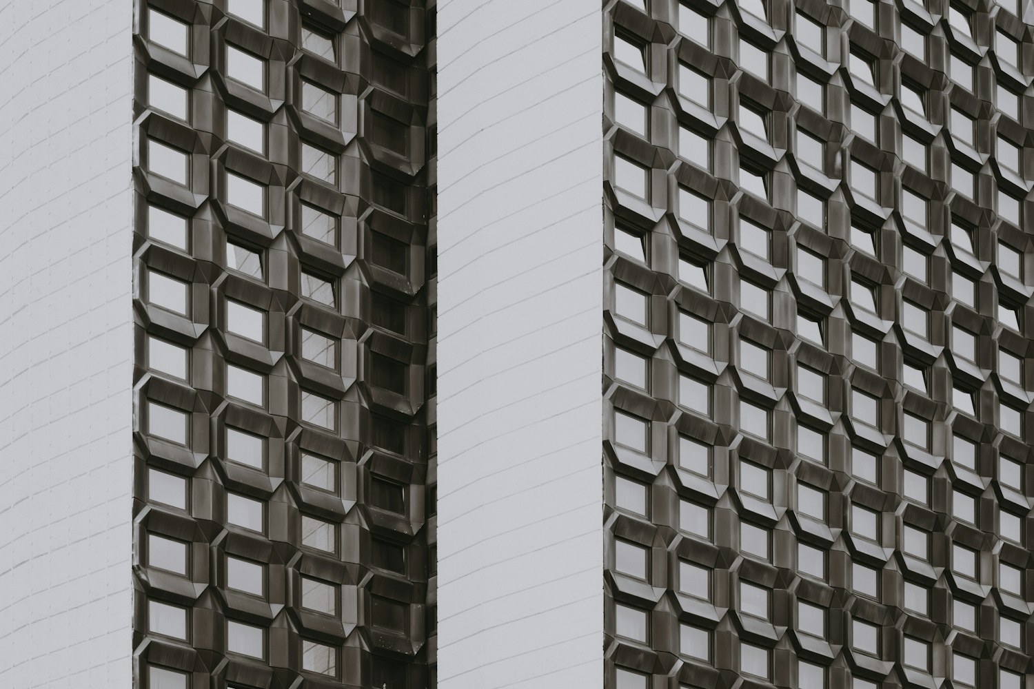 A geometric lattice pattern on a modern building facade