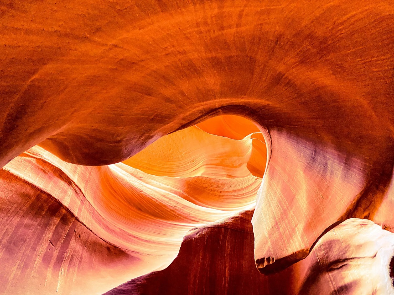 The swirling orange interior of a sandstone slot canyon